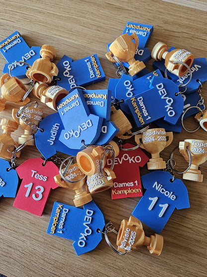 Unieke kampioen sleutelhanger als aandenken aan jouw overwinning.